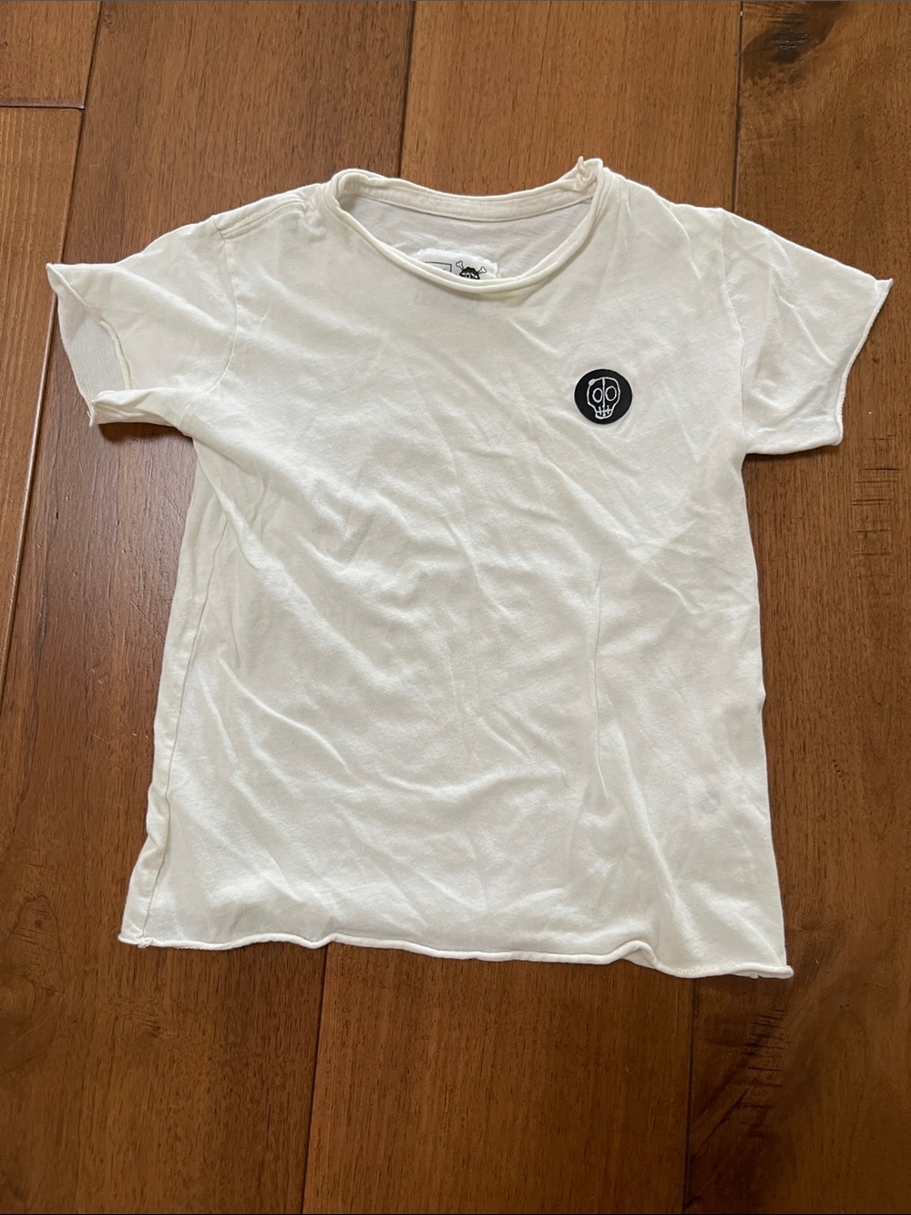nununu White Short Sleeve Tee with Black Skull Patch